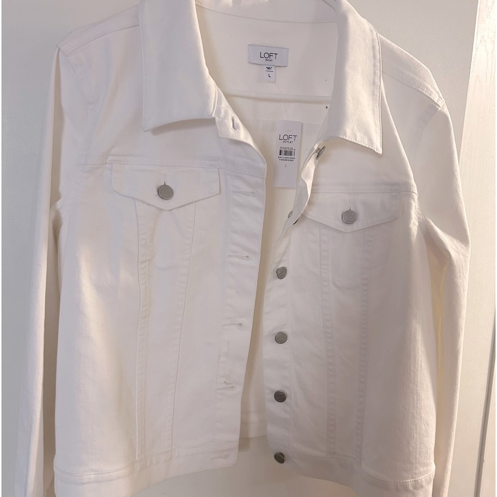 White jean jacket. Would look good in any type of attire.